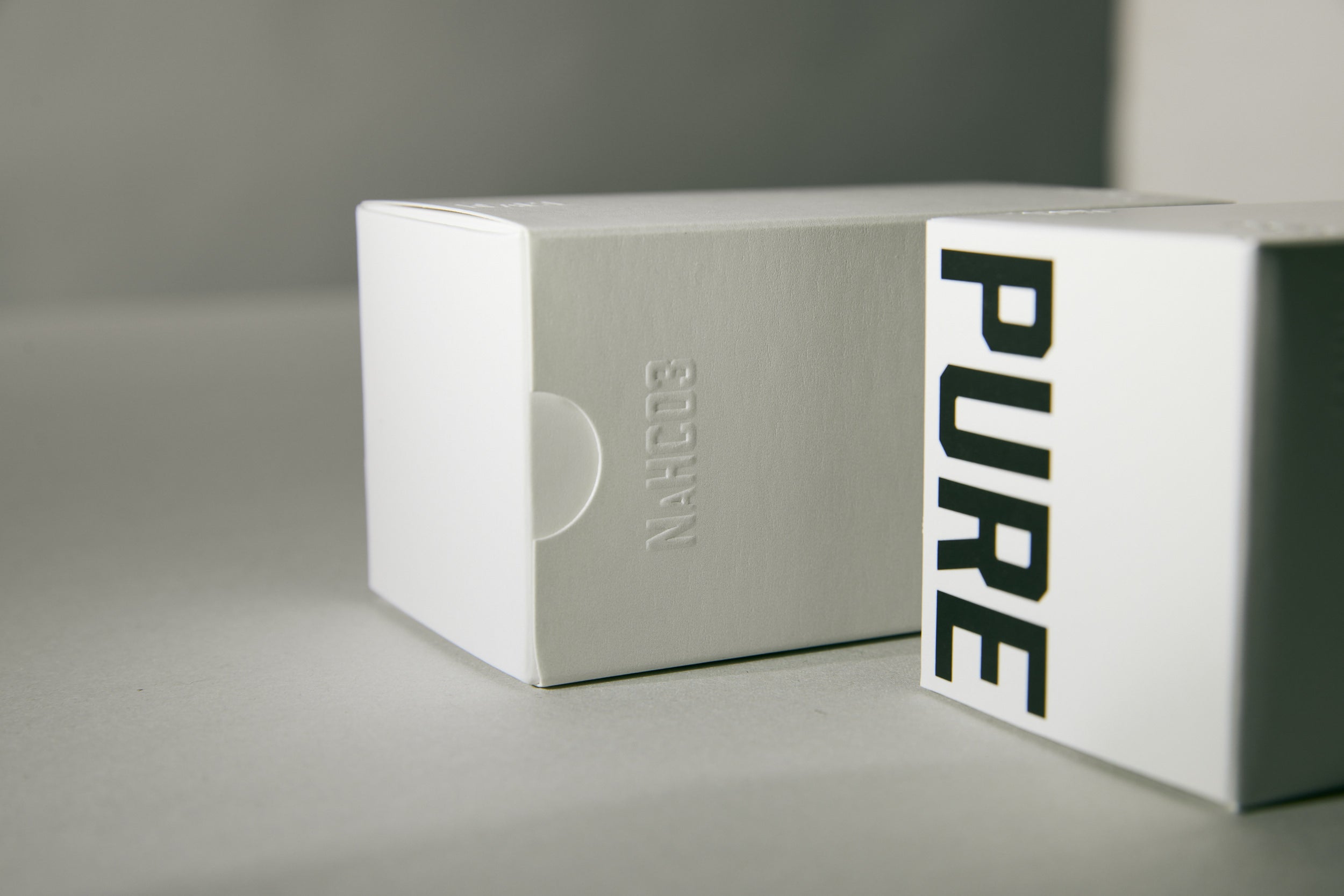 White box with 'PURE' branding on a gray background